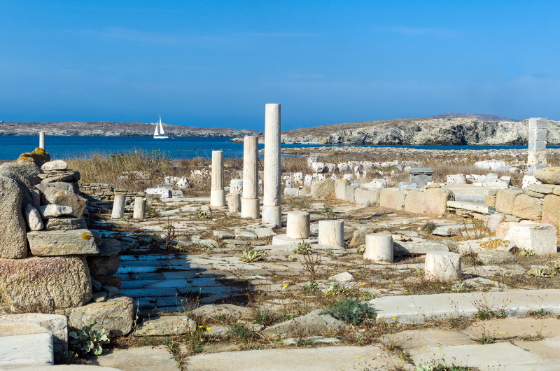 04-delos-island-ruins-columns-sea-view-greece