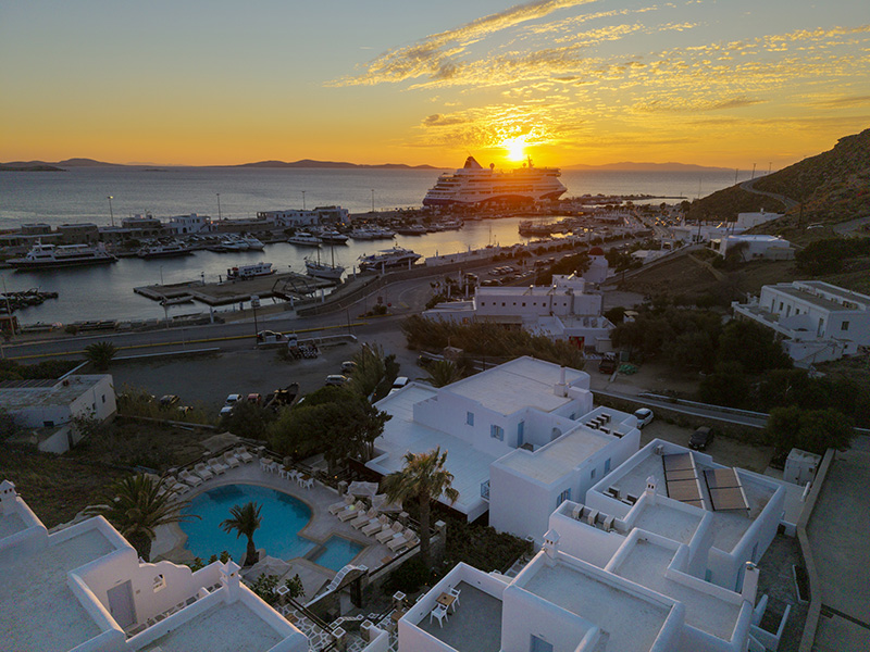 Aerial view of Makis Place Hotel and Mykonos New Port in Tourlos at sunset makis-place-hotel-view-mykonos-new-port-sunset